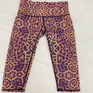 Teeki Purple Awakening Hot Pant, size medium. High rise, quick dry, cropped.